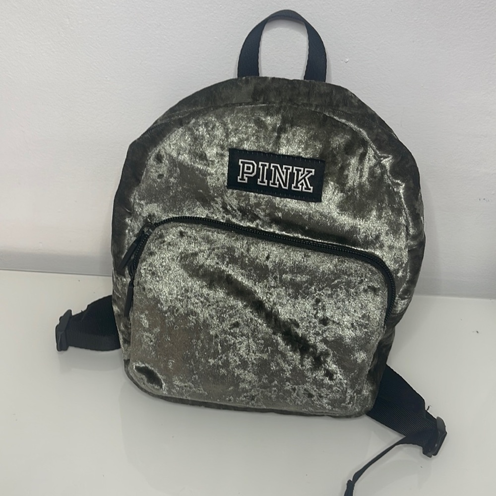 This is a mini Pink book bag This bag have two pockets and two adjustable straps